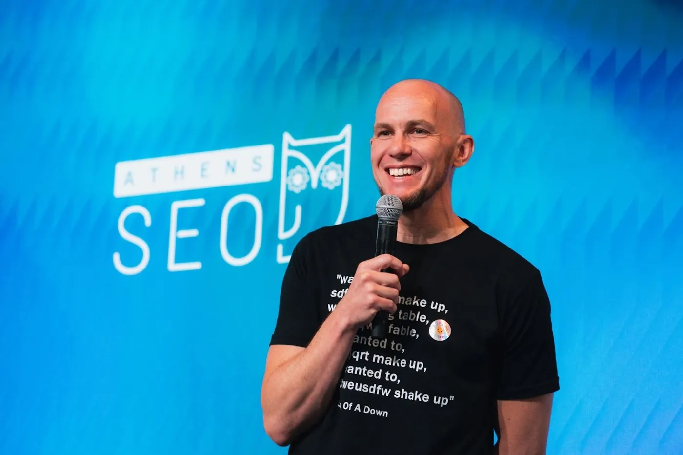 Mark speaking at a conference